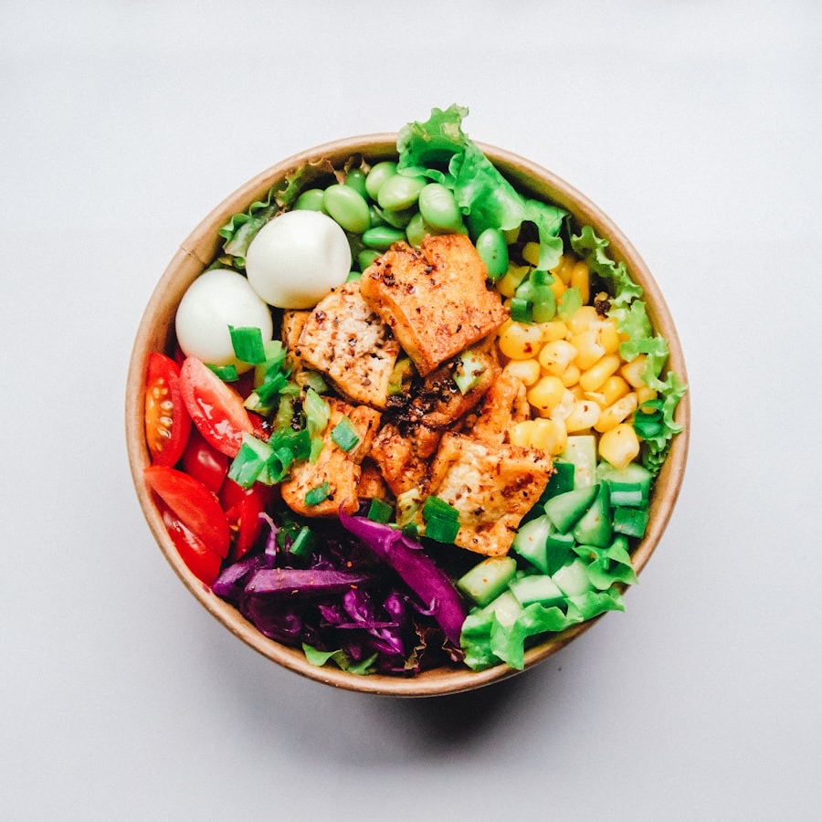 A bowl of fried tofu, quail eggs, sweet corn, edamame, cherry tomatoes, red cabbage, lettuce and cucumber, with scan corners over it